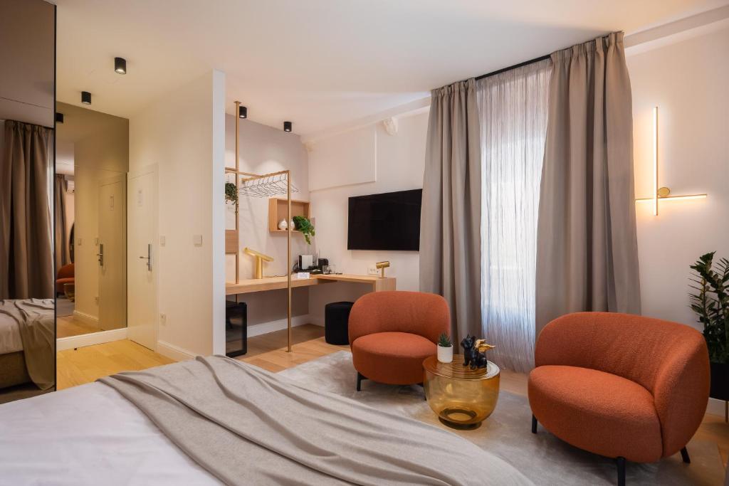TV a/nebo společenská místnost v ubytování Golden Gate Deluxe Room - Unique UNESCO Location
