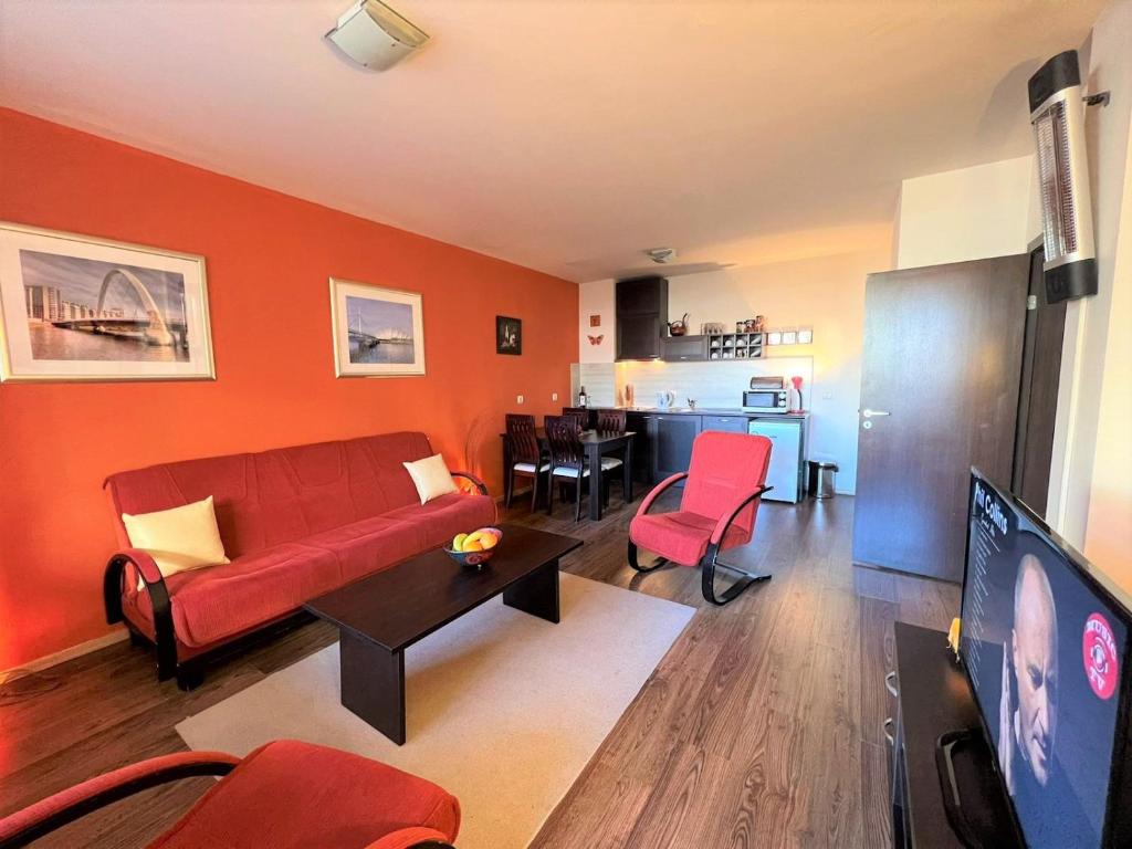 TV a/nebo společenská místnost v ubytování Bansko Royal Towers apartment Star