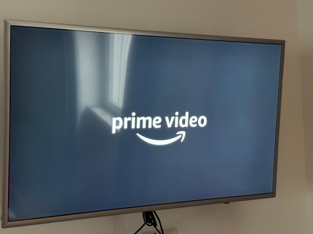 TV a/nebo společenská místnost v ubytování Aria di Casa Experience