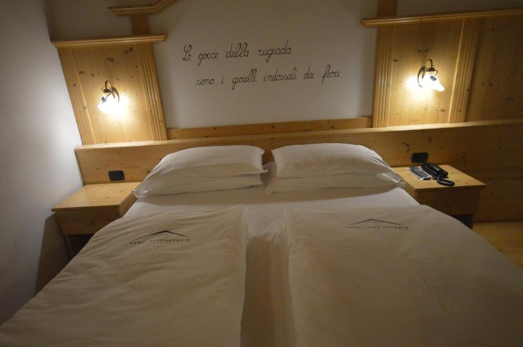Postel nebo postele na pokoji v ubytování Hotel Garnì Sant'Antonio con Spa