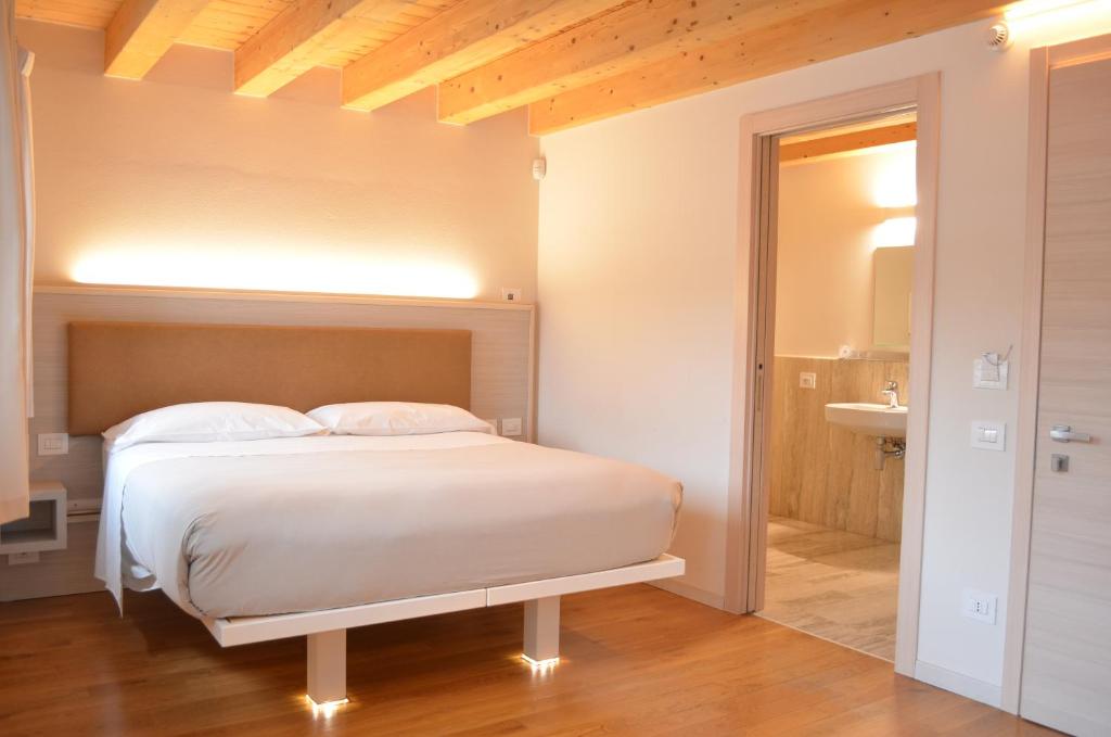 Postel nebo postele na pokoji v ubytování Residenza Ai Capitelli