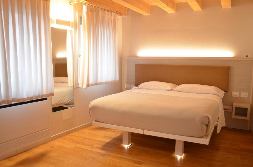 Postel nebo postele na pokoji v ubytování Residenza Ai Capitelli