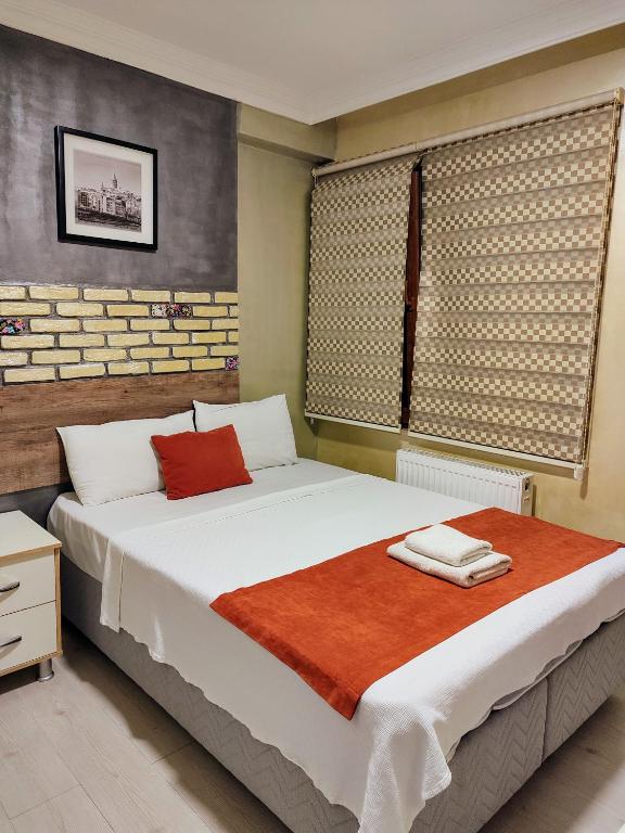 Postel nebo postele na pokoji v ubytování ADOR TROIA HOTEL
