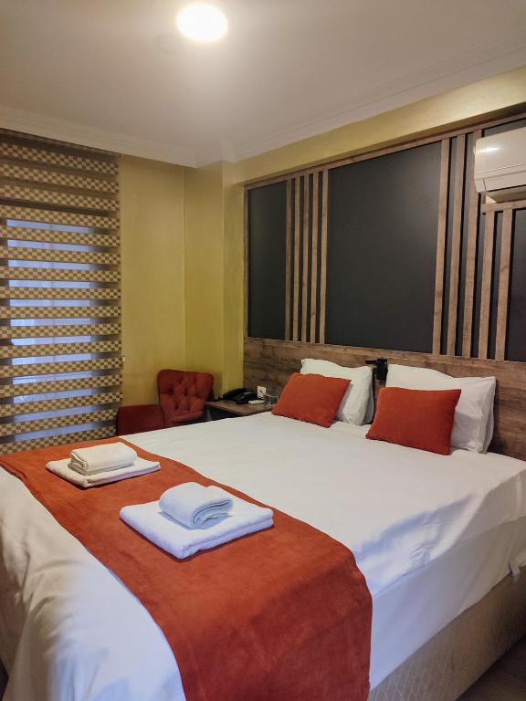 Postel nebo postele na pokoji v ubytování ADOR TROIA HOTEL