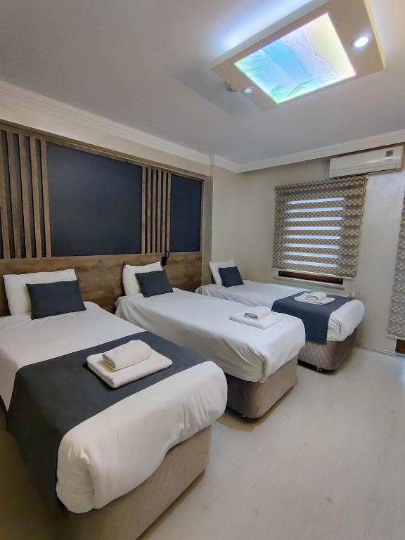 Postel nebo postele na pokoji v ubytování ADOR TROIA HOTEL