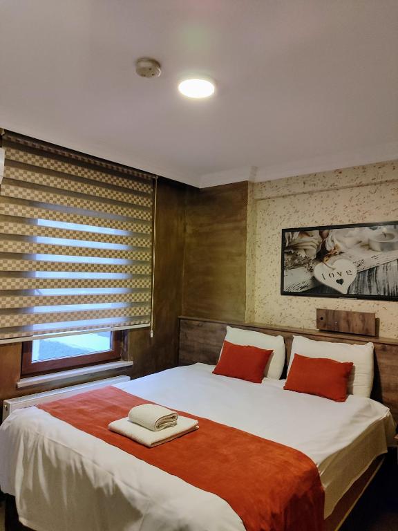 Postel nebo postele na pokoji v ubytování ADOR TROIA HOTEL