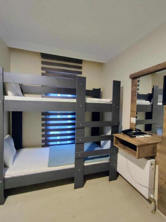 Postel nebo postele na pokoji v ubytování ADOR TROIA HOTEL