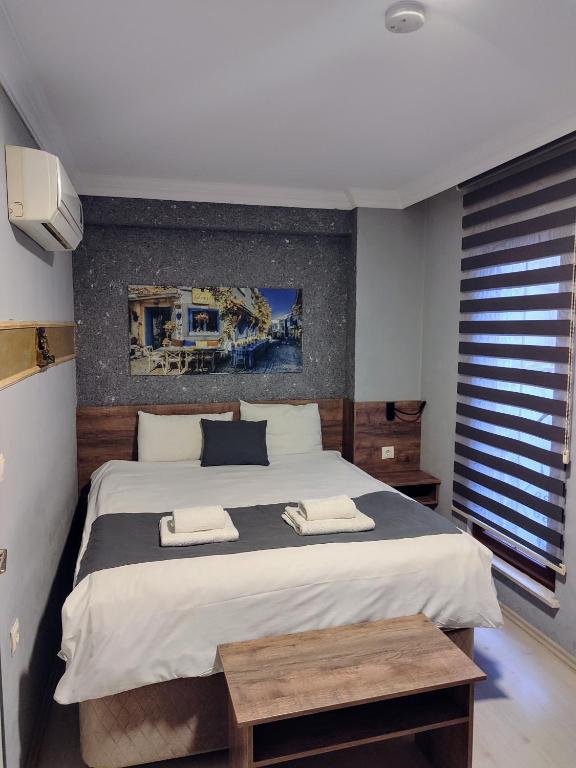 Postel nebo postele na pokoji v ubytování ADOR TROIA HOTEL