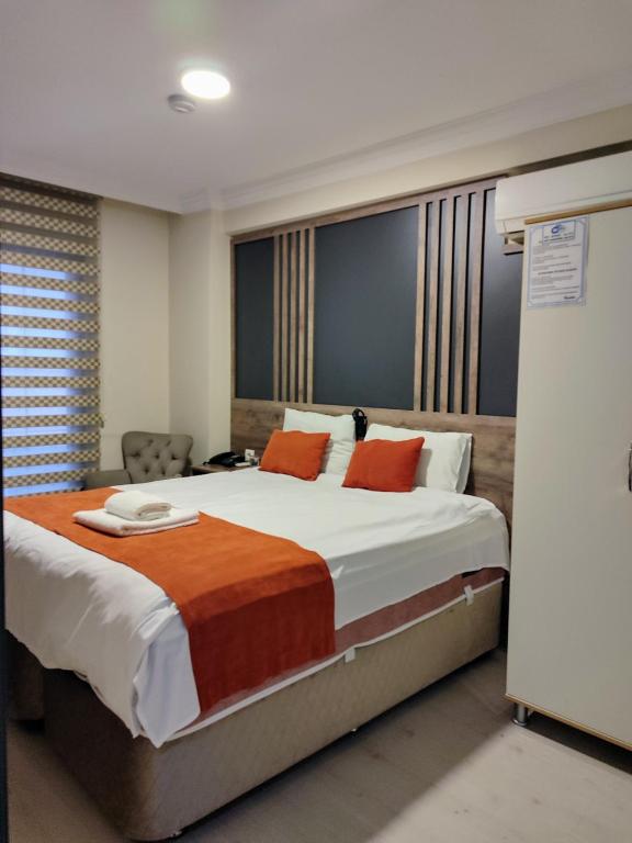 Postel nebo postele na pokoji v ubytování ADOR TROIA HOTEL