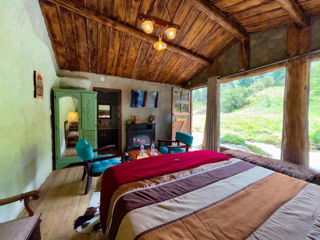 En eller flere senge i et værelse på MOLINO DEL PUENTE