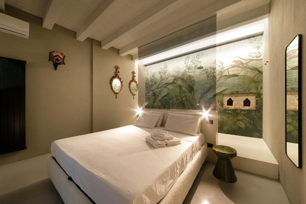 Postel nebo postele na pokoji v ubytování Isonzo Suites Relax