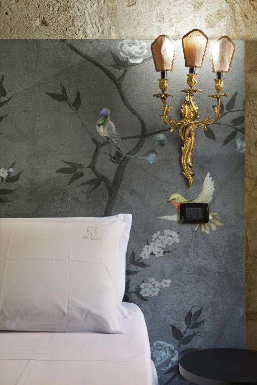Postel nebo postele na pokoji v ubytování Isonzo Suites Relax