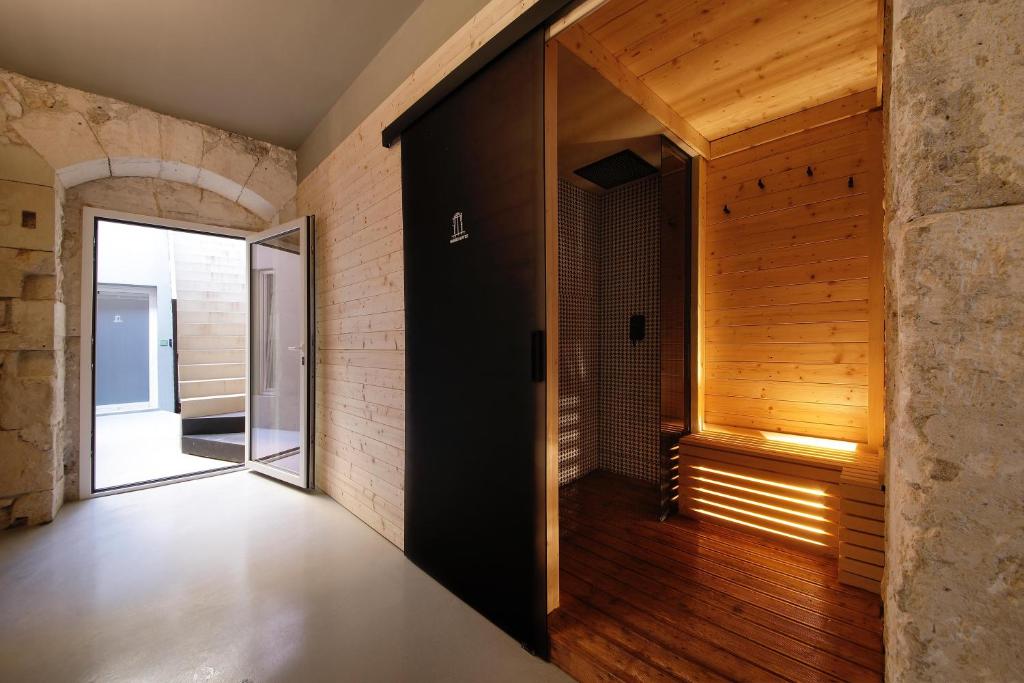 Postel nebo postele na pokoji v ubytování Isonzo Suites Relax