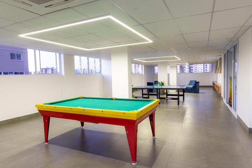 a pool table in the middle of an office hall at Evian Thermas Residence in Caldas Novas
