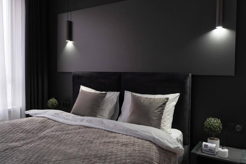 Postel nebo postele na pokoji v ubytování Chisinau Apartments Shadow