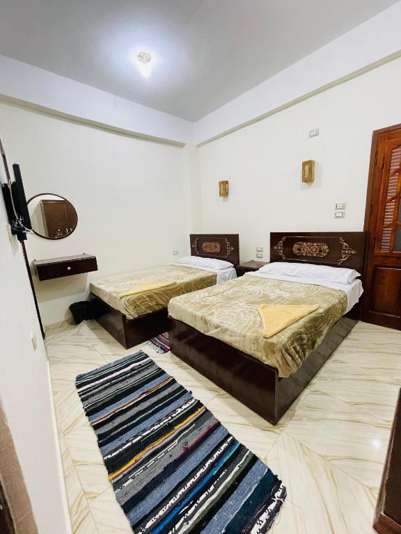 Postel nebo postele na pokoji v ubytování Adrar nshal ادرار نشال