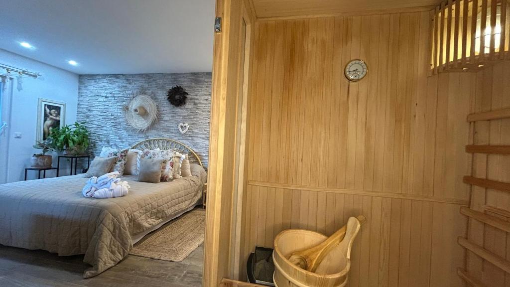 Postel nebo postele na pokoji v ubytování Loft sauna balnéothérapie