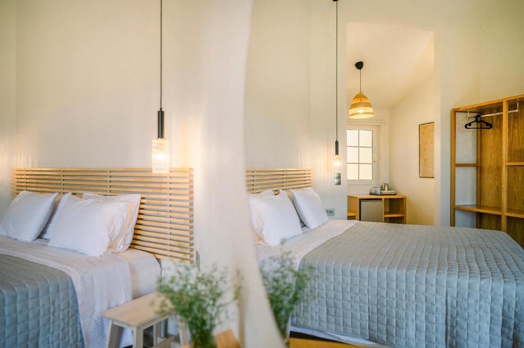 Postel nebo postele na pokoji v ubytování Legends Hotel Sidari Corfu