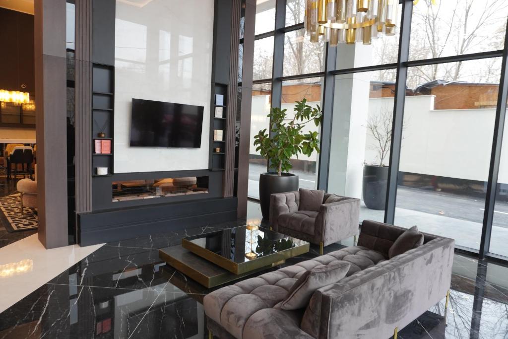 TV a/nebo společenská místnost v ubytování New Belgrade Premium Hotel