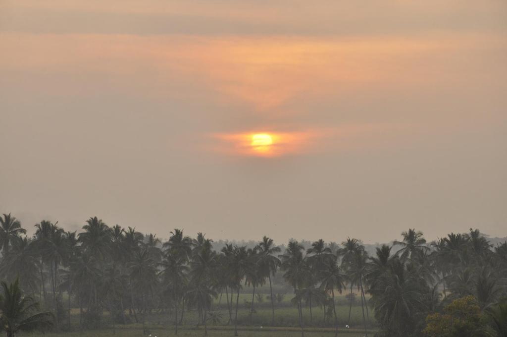 Hotel room view and balcony at Hemanth Heritage Hotel, Hampi