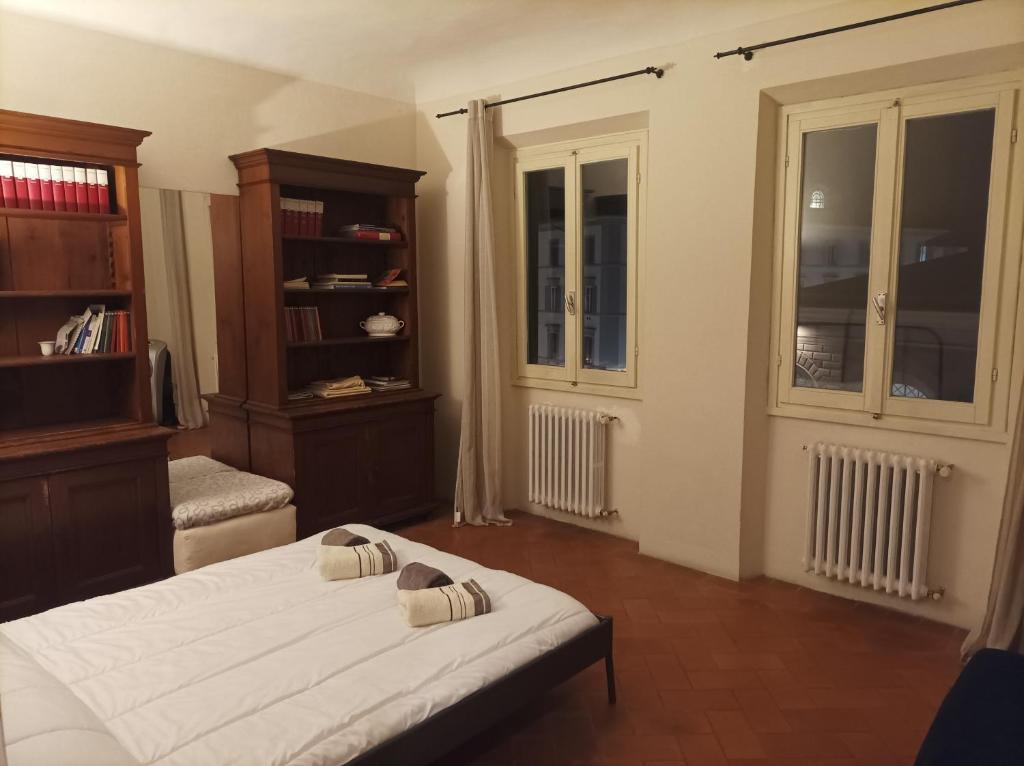 A bed or beds in a room at Panoramic Suite near Duomo and Station