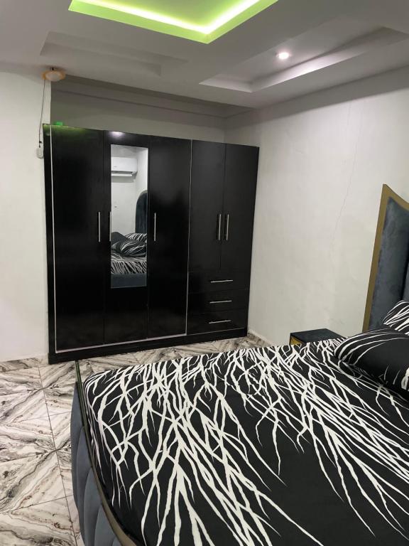 Postel nebo postele na pokoji v ubytování QuiQ Suites