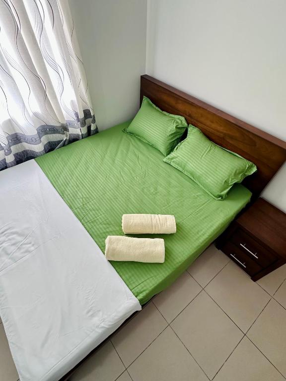 Postel nebo postele na pokoji v ubytování Urban Nest Studio