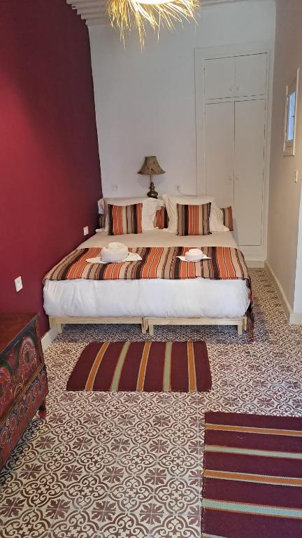 Postel nebo postele na pokoji v ubytování SUMMER HOUSE TANGER