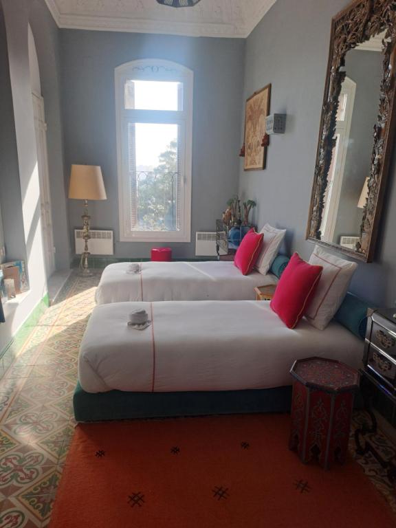 Postel nebo postele na pokoji v ubytování SUMMER HOUSE TANGER