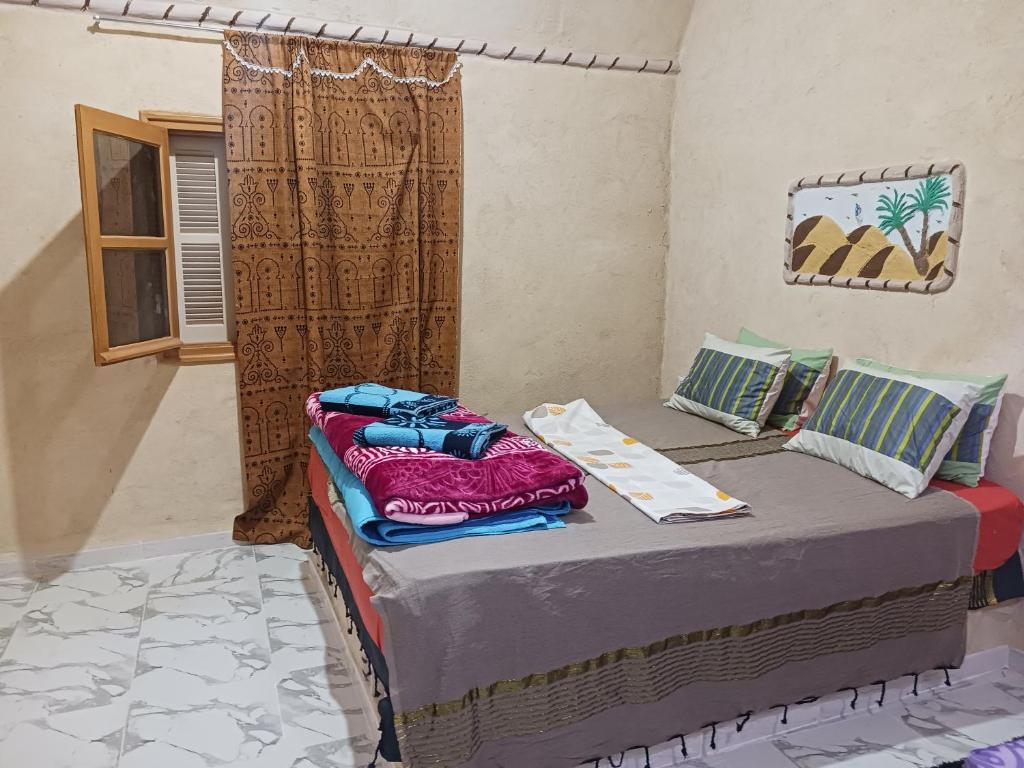 Postel nebo postele na pokoji v ubytování Maisons la Porte de Désert à Douz