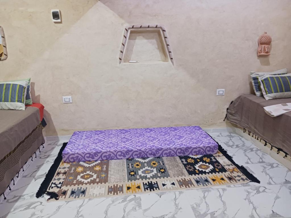 Postel nebo postele na pokoji v ubytování Maisons la Porte de Désert à Douz