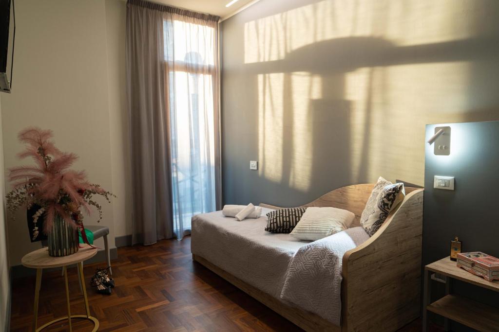 Postel nebo postele na pokoji v ubytování Hotel Ambrosiano