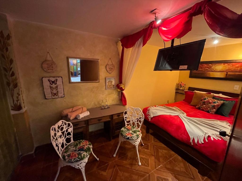 Postel nebo postele na pokoji v ubytování HOSTAL SEP7IMO ARTE