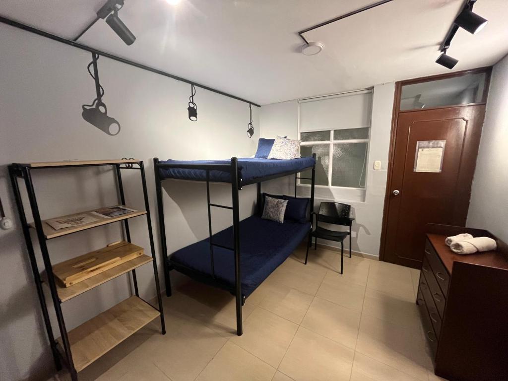 Postel nebo postele na pokoji v ubytování HOSTAL SEP7IMO ARTE