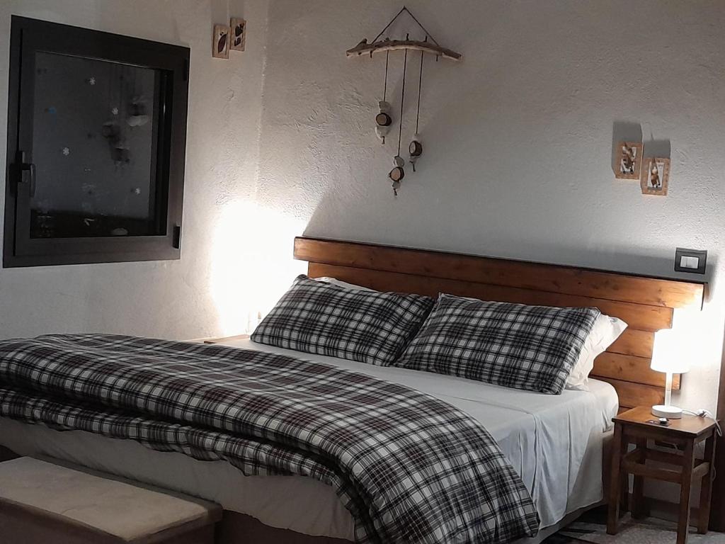 Postel nebo postele na pokoji v ubytování Etna Country Home