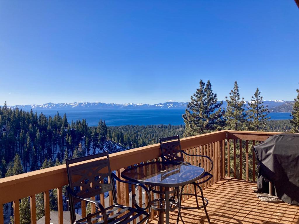 a patio with a table and chairs on a balcony at Bear-foot Retreat in Incline Village
