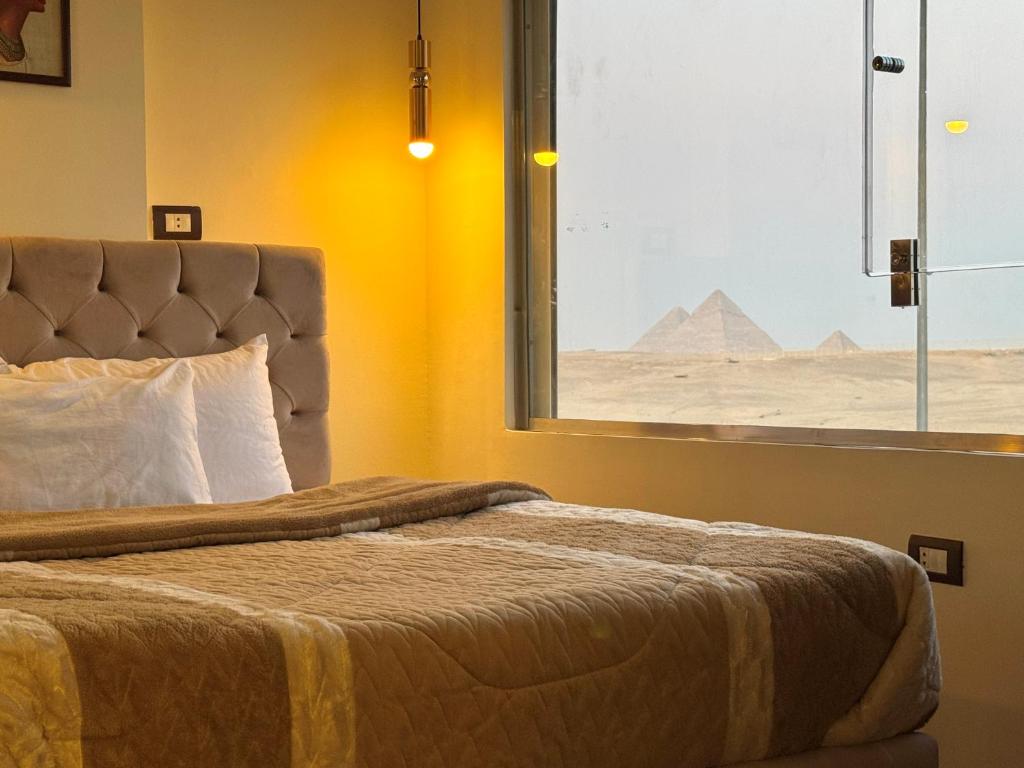 Postel nebo postele na pokoji v ubytování White Pyramids inn