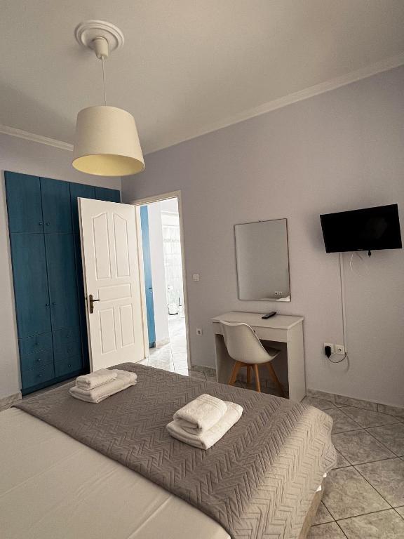 Postel nebo postele na pokoji v ubytování Esperia Studios