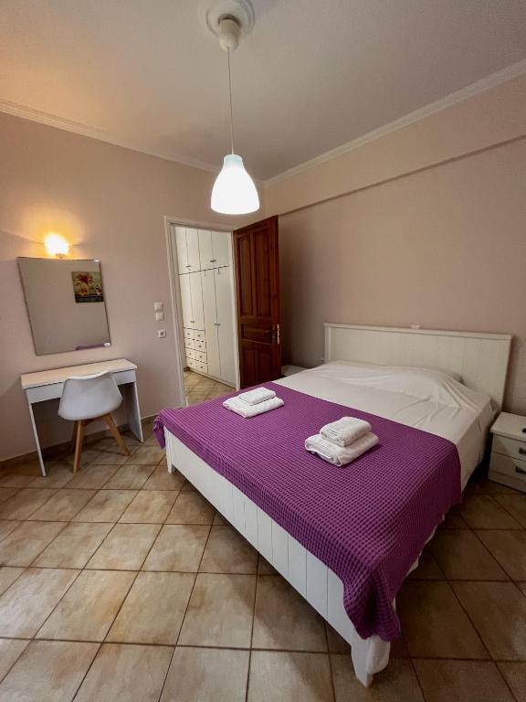 Postel nebo postele na pokoji v ubytování Esperia Studios