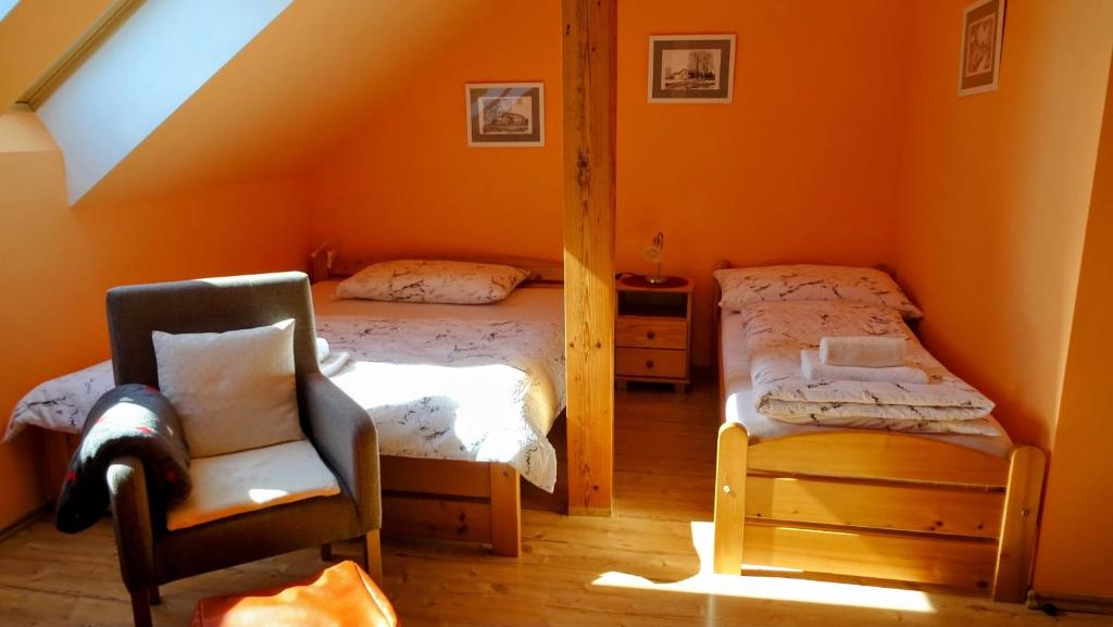 Postel nebo postele na pokoji v ubytování Apartmán Nesyt