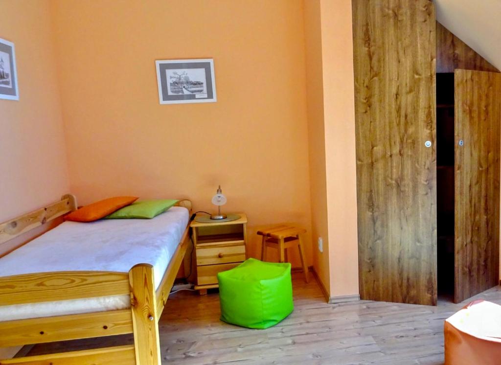 Postel nebo postele na pokoji v ubytování Apartmán Nesyt