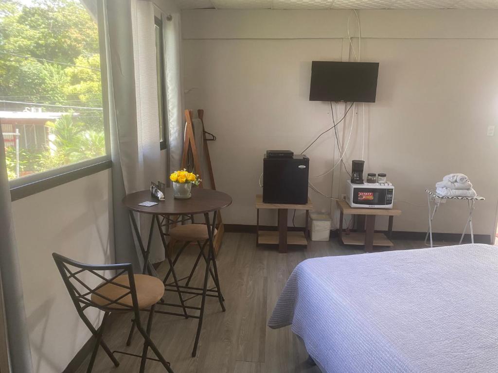 TV a/nebo společenská místnost v ubytování D'Rosas Apartments