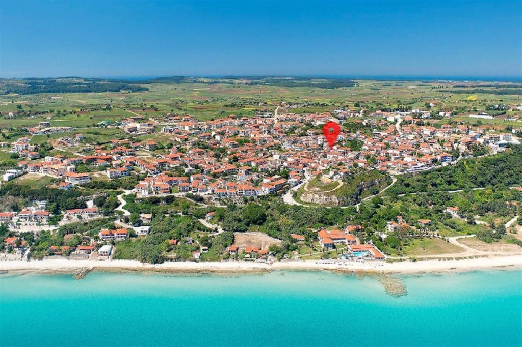 an aerial view of a town on the beach at Afitos Guest House in Afitos