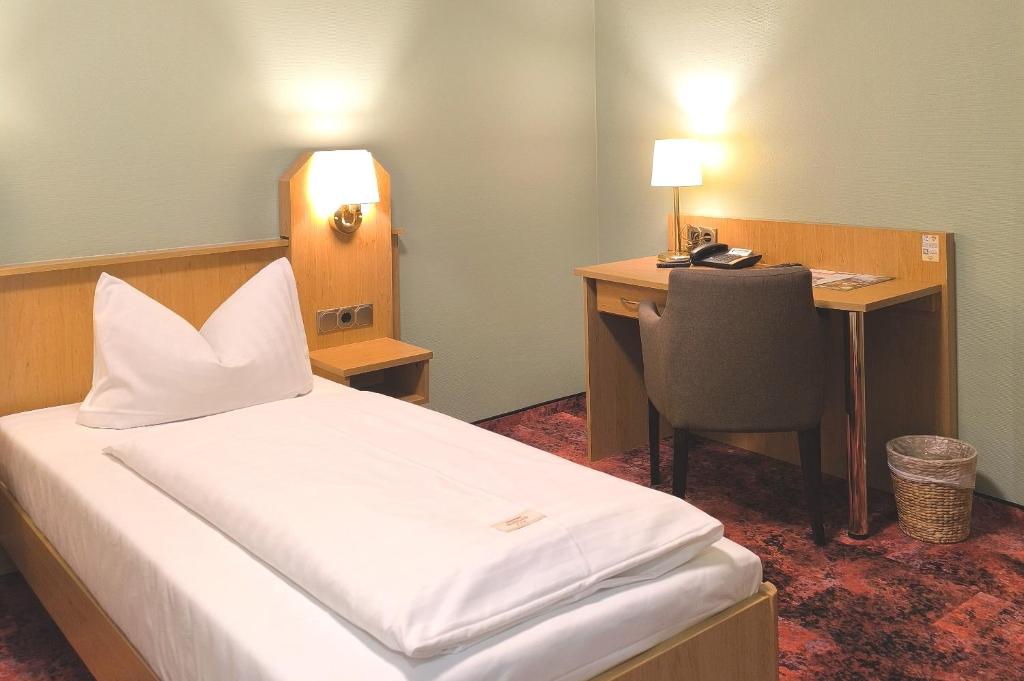 Postel nebo postele na pokoji v ubytování Hotel Burgas