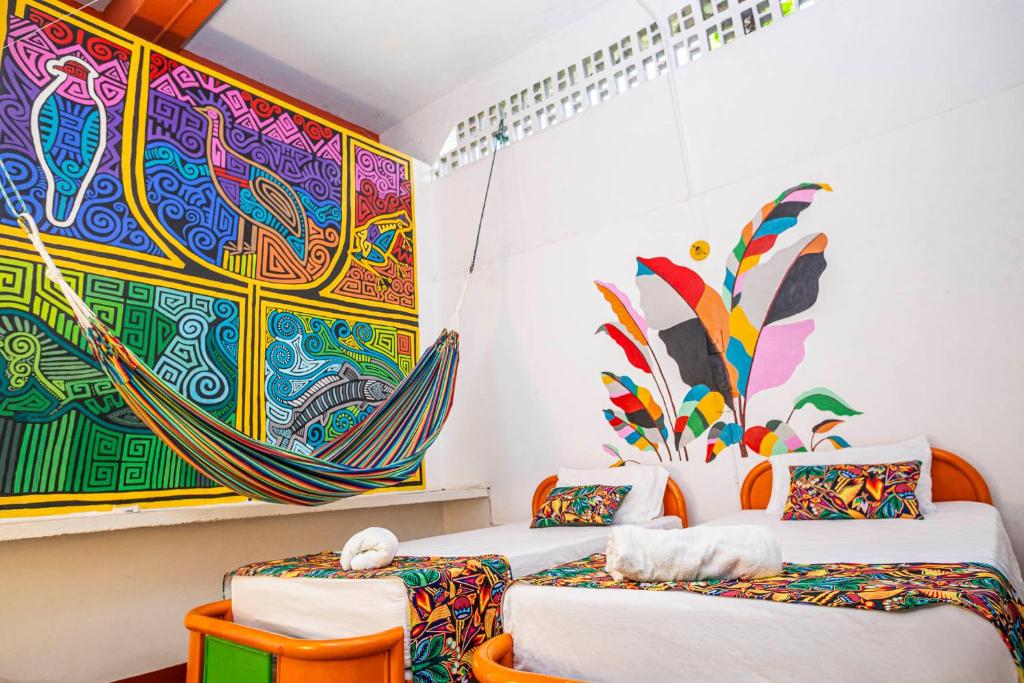 Postel nebo postele na pokoji v ubytování Hotel Kasa Dokari