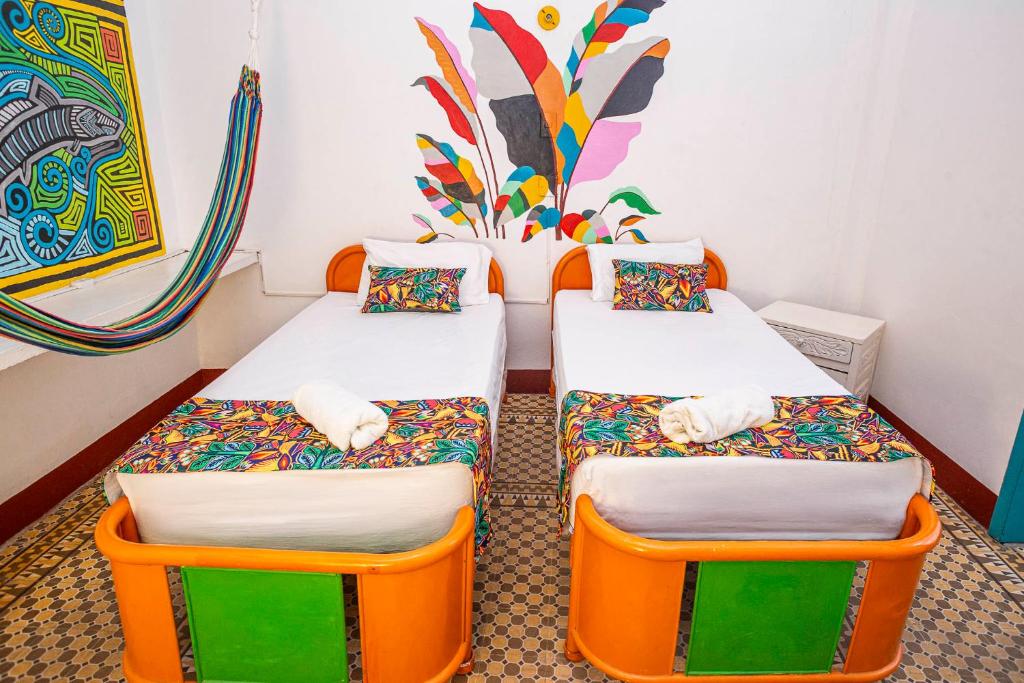 Postel nebo postele na pokoji v ubytování Hotel Kasa Dokari