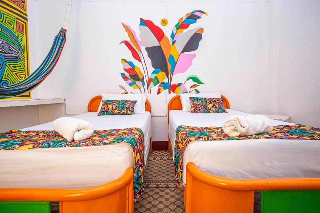 Postel nebo postele na pokoji v ubytování Hotel Kasa Dokari