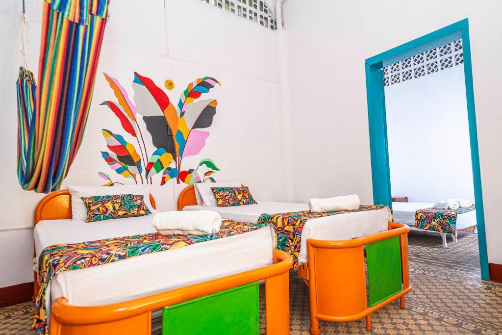 Postel nebo postele na pokoji v ubytování Hotel Kasa Dokari