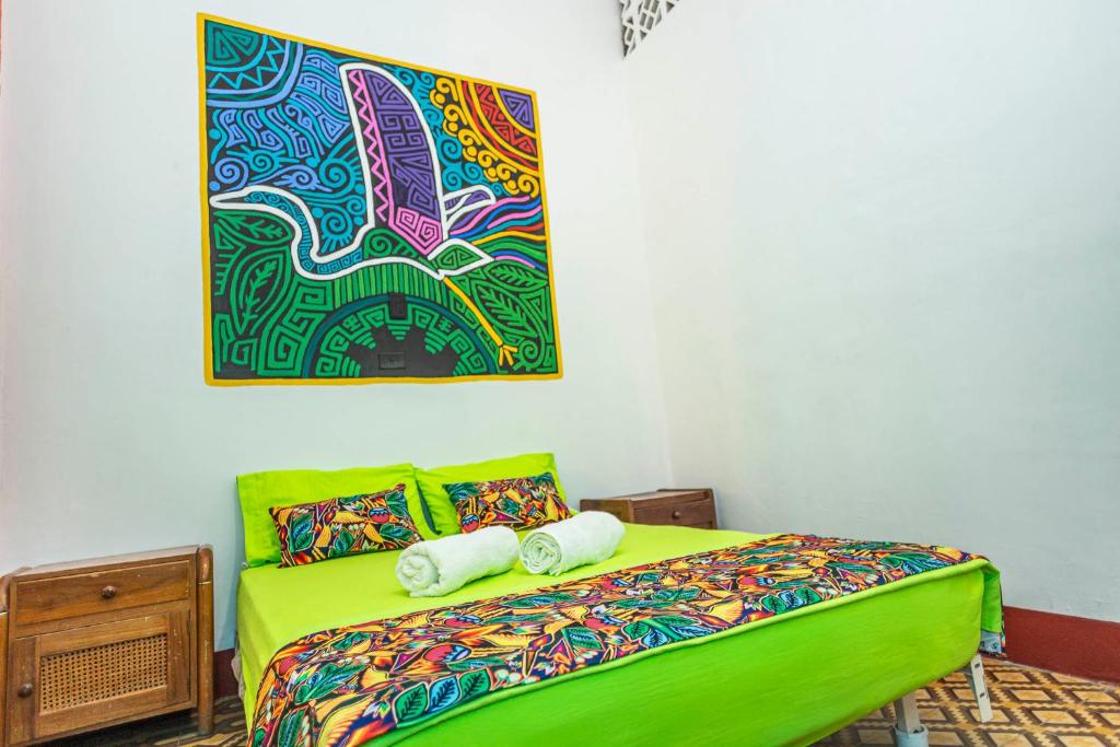 Postel nebo postele na pokoji v ubytování Hotel Kasa Dokari