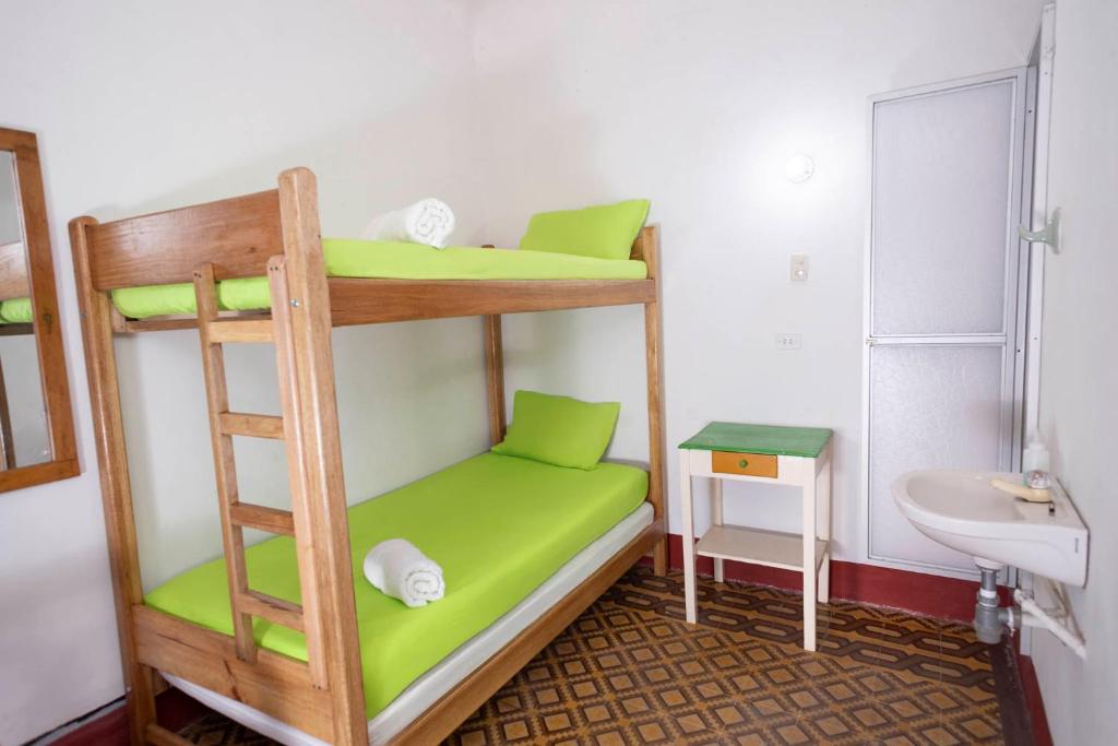 Postel nebo postele na pokoji v ubytování Hotel Kasa Dokari